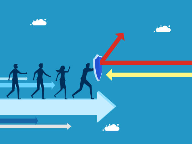 istock Overcome business crises. Business team holding shield on arrow moving forward 1500200161