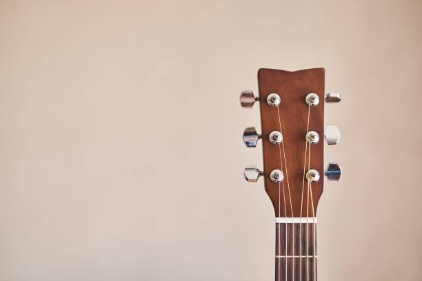 istock Acoustic guitar headboard with pegs. Guitar fretboard. 1500203231