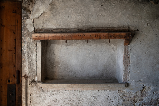 Old house interior with empty niche.