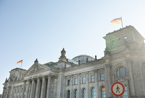 Berlin, Germany, May 2023. The Bundestag building, Parliament of the Federal Republic of Germany, with German flag flying outside.