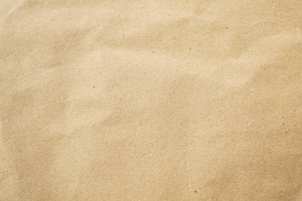 istock Brown crumple recycle paper texture background 1500206610