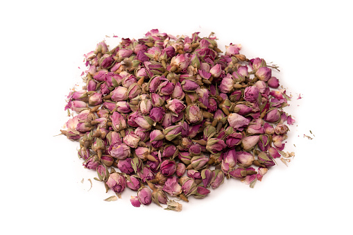 Dry tea roses isolated on a white background.