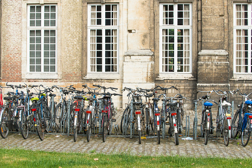 Leuven, Belgium - July 5, 2015: Parking, enabled bicycles in the courtyard of one of the faculties of the University of the city.