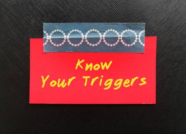 istock red card stick on black background KNOW YOUR TRIGGERS, learning to know experience of having emotional reaction to a disturbing topic in the media or social setting and empower to cope with it 1500212162