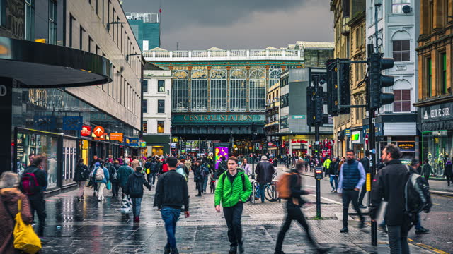 Time lapse of Crowd people and tourist pedestrian walking and shopping at Glasgow Central Station