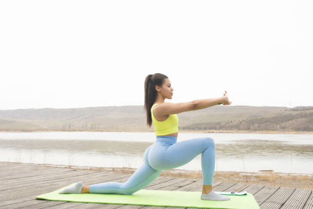 istock Attractive black woman doing stretching exercises. 1500213844