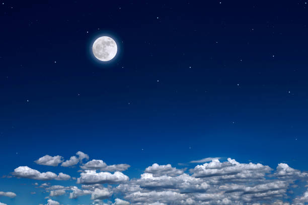 istock Full moon rising over the cloudscape 1500218833
