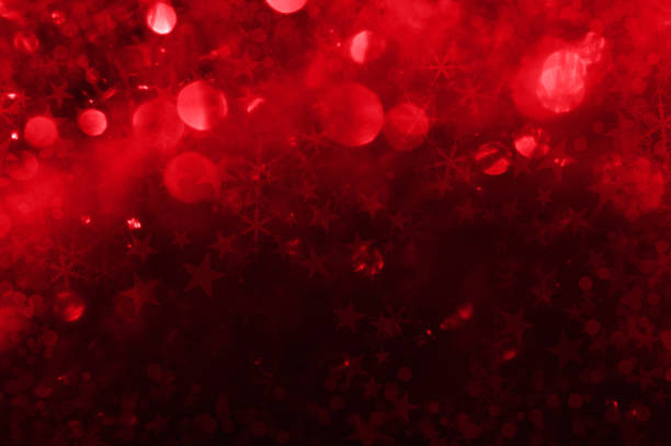 Highly detailed all over texture of an illustration of glittering stars on a red background.