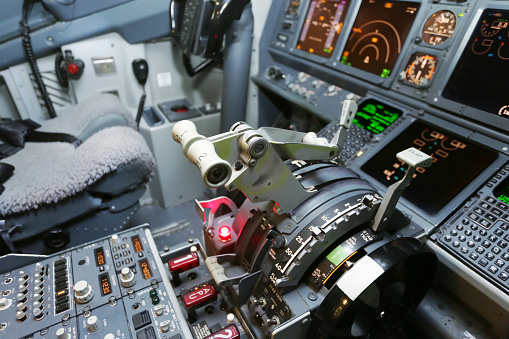 Inside the cockpit of a passenger aircraft. Close-up of thrust levers