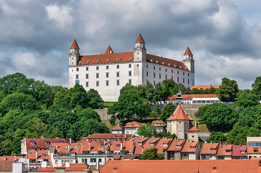 June 21, 2023: Bratislava, Slovaka - The cityscape and skyline of the city. The Bratislava Castle is the main subject in the picture and dominates the city with it's imposing presence.