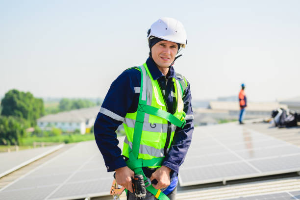 istock Engineers with safety helmet checking solar system at solar power farm 1500225660