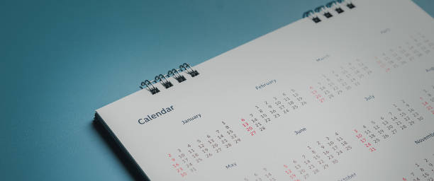 istock Embroidered red pins on a calendar event Planner calendar,clock to set timetable organize schedule,planning for business meeting or travel planning concept. 1500226600