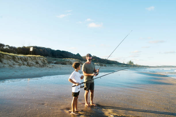istock Father and son getting ready for a fish on an Australian beach. 1500226883