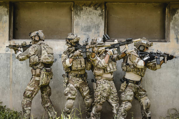istock Smart teamwork of soldiers running forward and attacking enemy 1500226899