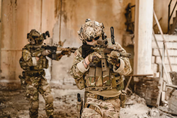 istock Expert team of soldiers with weapons attacking enemy 1500228825