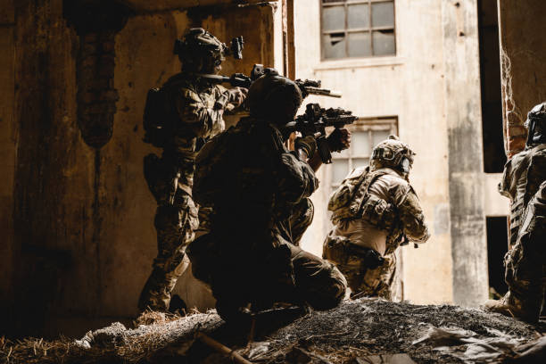 istock Expert team of soldiers attacking enemy during military operation 1500228934