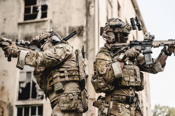 istock Expert team of soldiers attacking enemy during military operation 1500229218