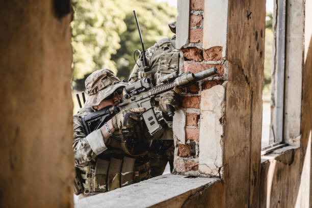 istock Smart teamwork of soldiers running forward and attacking enemy 1500229553