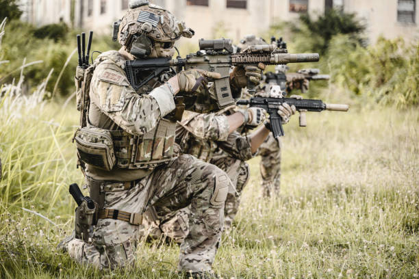 istock Smart teamwork of soldiers running forward and attacking enemy 1500230417