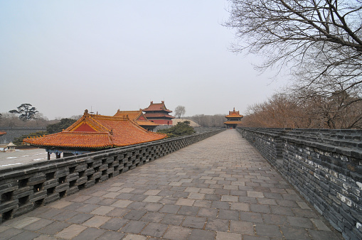 Shenyang, Liaoning, China- March 3, 2012: Zhaoling Tomb, also called North Tomb due to its location in the north of Shenyang, is the tomb of Hongtaiji (the Second Emperor in Qing Dynasty) and his wife. As one of tourist attractions and historic sites in Shenyang, Zhaoling Tomb is the essence of China's ancient architectures, and also the representative of cultural communication between Manchus and Han nationalities. Here is the wall and tower over underground burial chamber in the tomb.