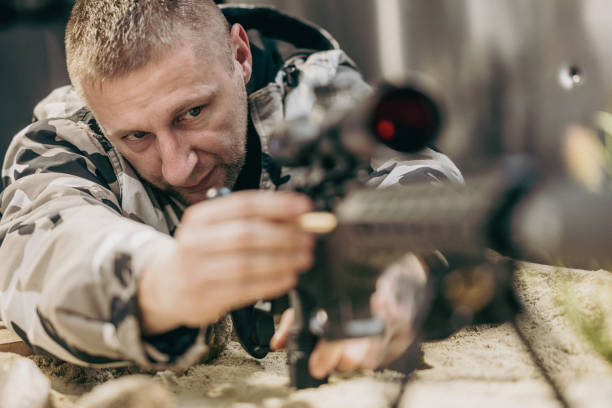 istock Soldier shooting rifle 1500235079