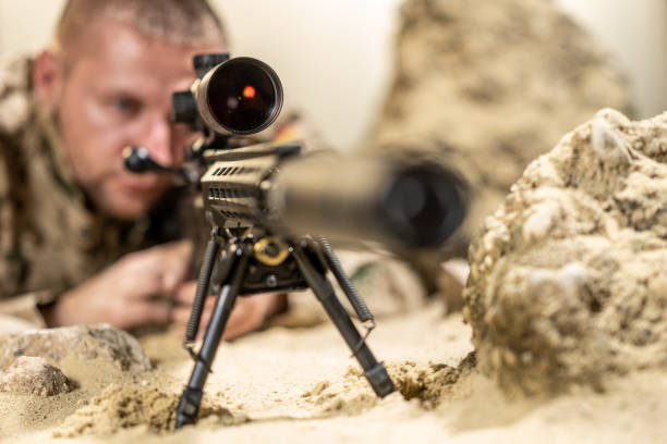 istock Soldier shooting rifle 1500235101