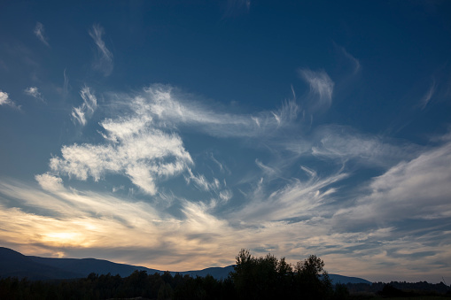 Clouds at sunset above the Gulf of Porto-Vecchio, viewed from a viewpoint at road D368 nearby L’Ospédale, Corsica, France