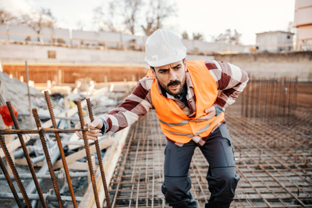 istock A site worker is touching his painful stomach and having stomach ache. 1500236287