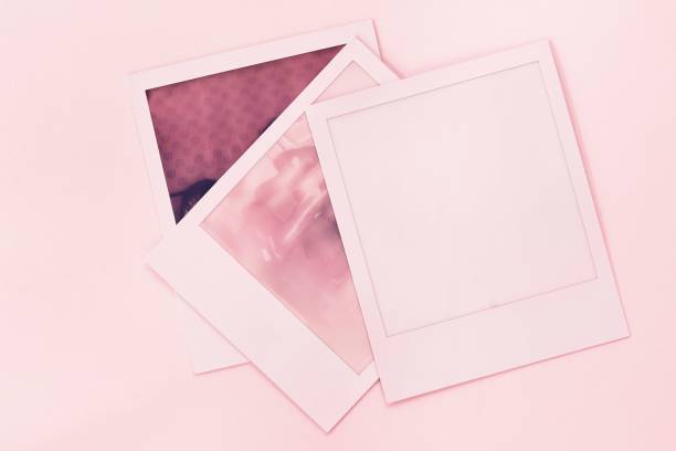 istock Three instant photos on a colored and lighted background. 1500238439
