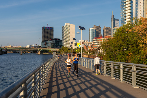 Philadelphia, Pennsylvania - October 01, 2019: Schuylkill River Trail in Philadelphia, Pennsylvania. Schuylkill Banks Park with a trail and skyline views. People are Running.