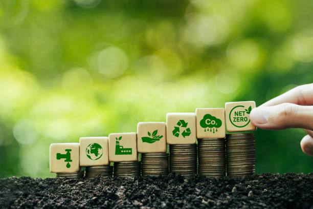 istock net zero and carbon neutral concept Zero net greenhouse gas emissions target Long-term, climate-neutral strategy Green icon on wooden block green background 1500242173