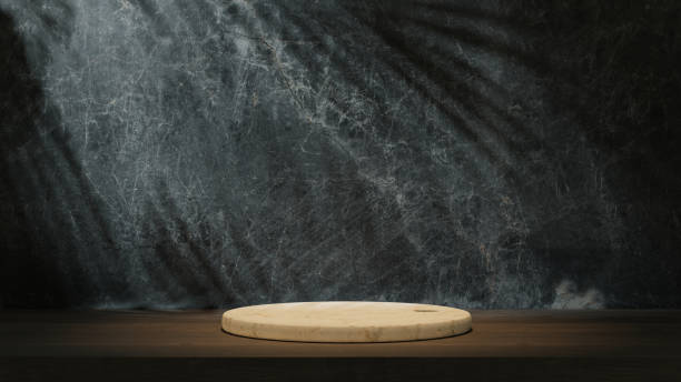 istock Kitchen desk on the table with dark marble wall background. Light shadow on the wall. 1500243529