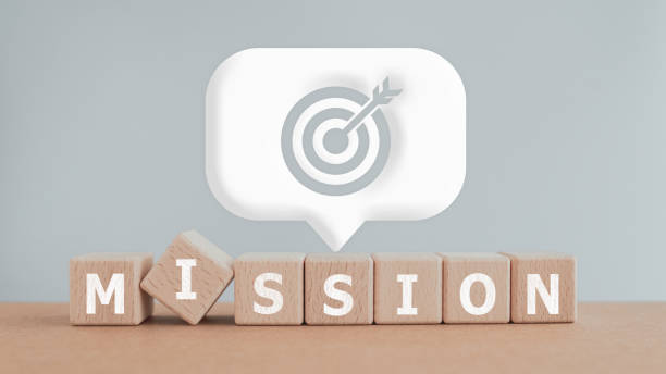 istock MISSION text on wooden cube blocks and white speech bubble with dartboard icon. For business purposes and strategy, planning concept 1500244464