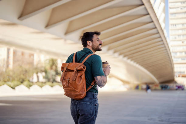 istock A happy tourist with coffee is going sightseeing in Barcelona. 1500252318