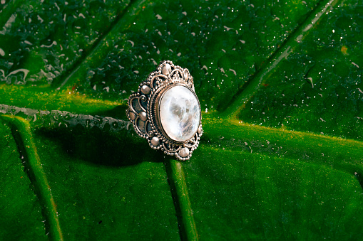 Ring with a white gem