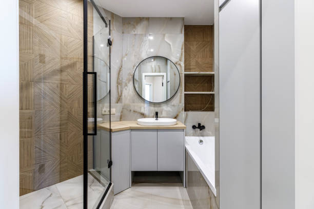 istock Modern bathroom with black fixtures, mirror and white sink 1500255849