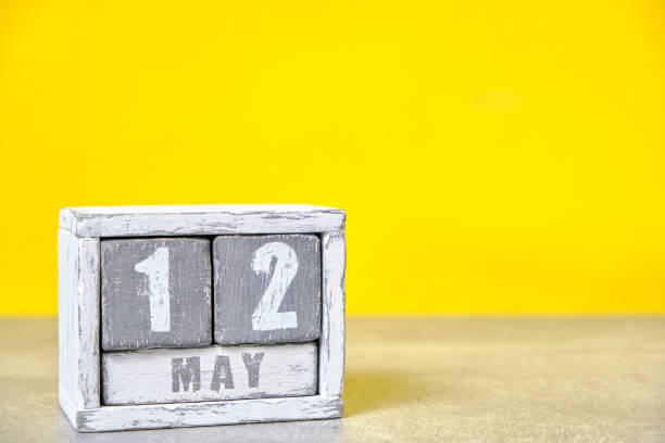 istock May 12 calendar made wooden cubes yellow background.With an empty space for your text.International Day nurse. 1500256520