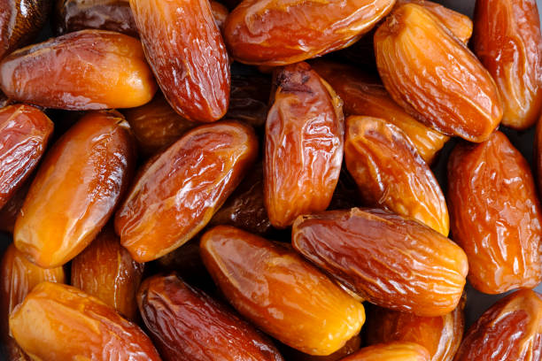 istock Dried dates closeup.Edible fruits date palm. 1500259490
