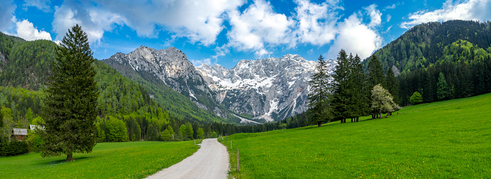 Zgornje Jezersko valley in Slovenia during a beautiful springtime day with the mountain range in the Kamnik–Savinja Alps.