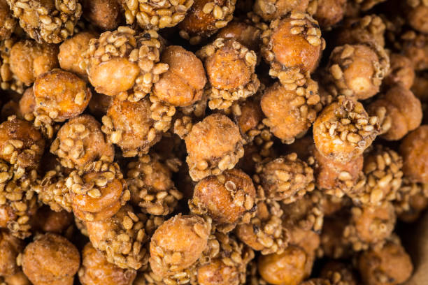 istock Sesame coated chickpeas with honey  on white background 1500261007