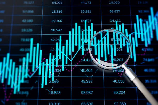 istock Growing blue forex chart grid with magnifying glass on black backdrop. 1500261051