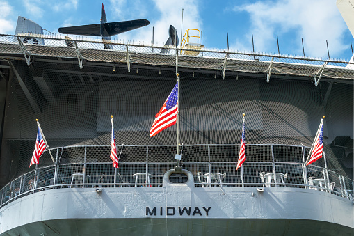 American flags at the stern of the USS Midway in San Diego, California