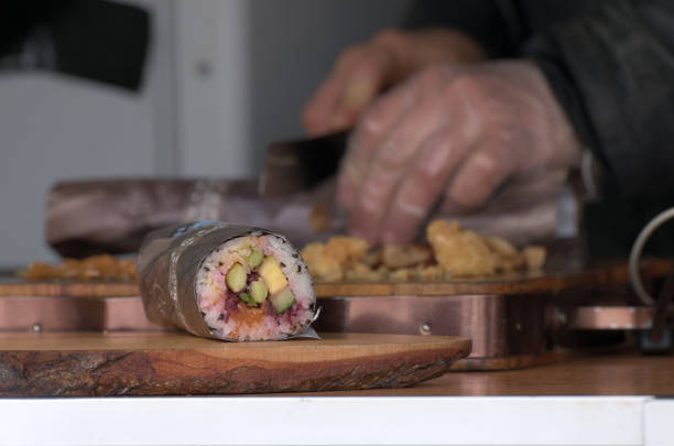 istock Vegan sushi roll on wooden board 1500263165