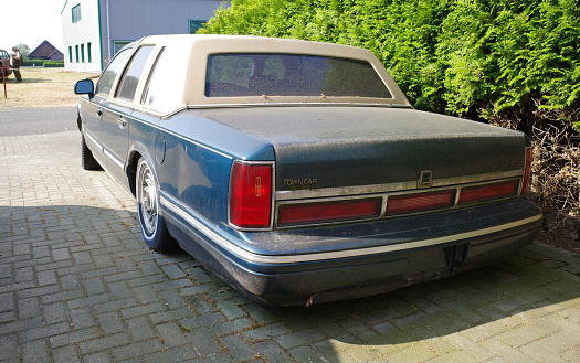 Neulehe, Germany - June 18 2023 A dirty circa 1995 Lincoln Town Car Executive Series is parked.