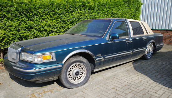 Neulehe, Germany - June 18 2023 A dirty circa 1995 Lincoln Town Car Executive Series is parked.