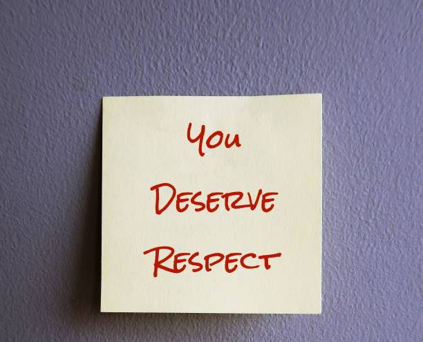 istock Yellow note with text written YOU DESERVE RESPECT stick on gray wall, concept of self remender to get or earn respect you deserve and never let people treat you like a doormat 1500266099