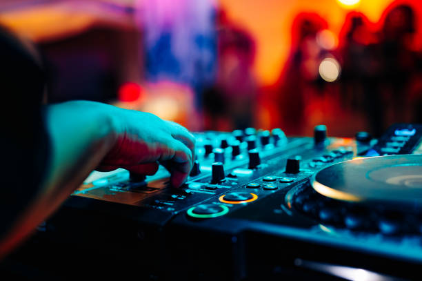 istock DJ Hands creating and regulating music on dj console mixer in concert 1500267189