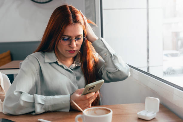 istock Redhead Girl. Tech-savvy Red-haired Woman Thrives in Remote Work Environment 1500283914