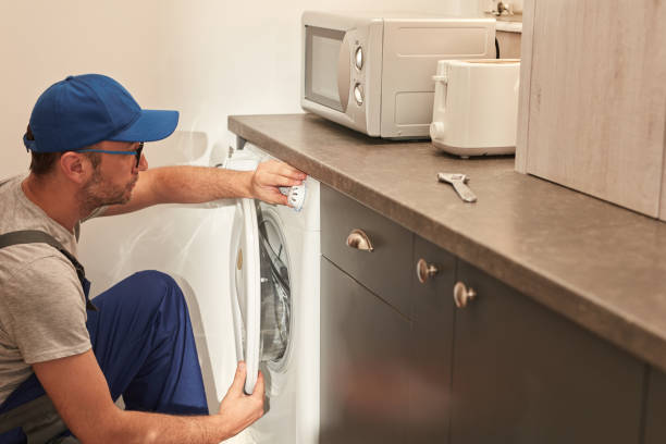 istock Handyman fixing broken washing machine in the apartment. 1500284247