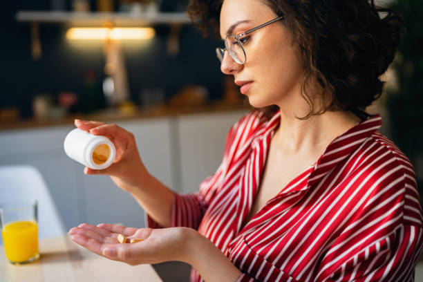istock Young woman taking medicines 1500286874